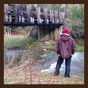man by river